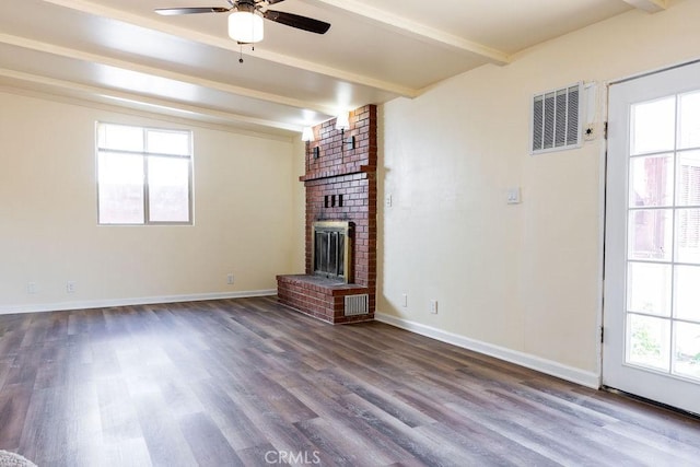 unfurnished living room with beam ceiling, a fireplace, ceiling fan, and hardwood / wood-style flooring