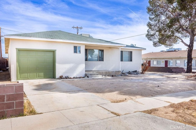 single story home featuring a garage