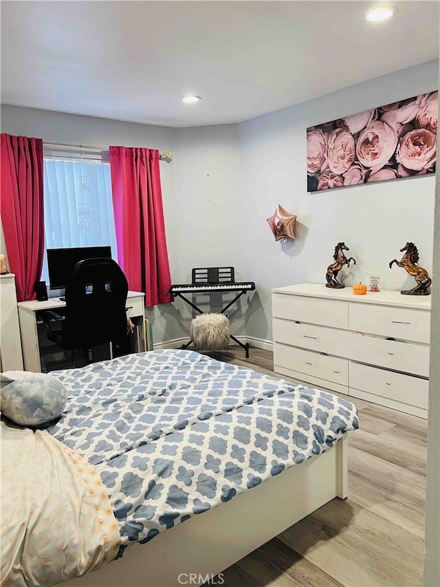 bedroom featuring light hardwood / wood-style floors