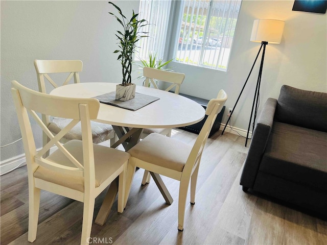 dining space featuring hardwood / wood-style floors