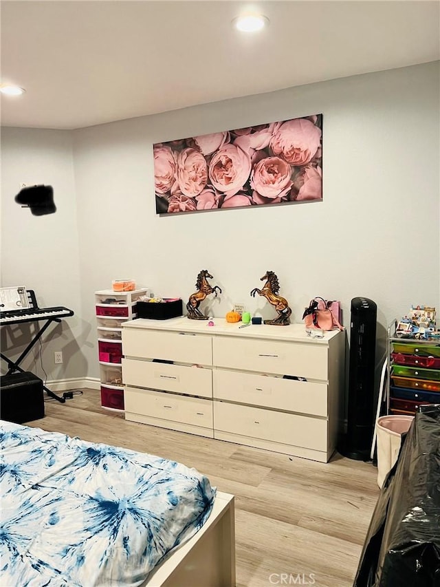 bedroom with light hardwood / wood-style flooring