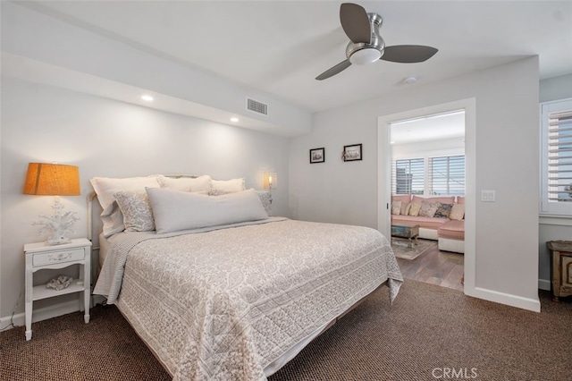 carpeted bedroom featuring recessed lighting, visible vents, ceiling fan, and baseboards