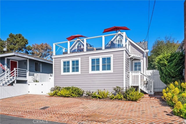 view of front of home with a balcony