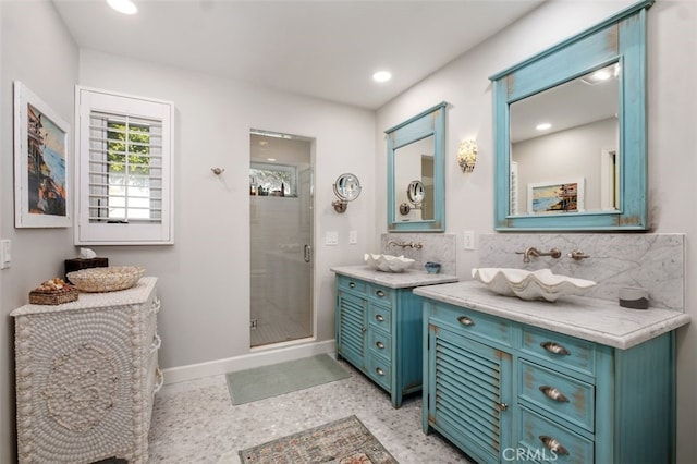 bathroom with recessed lighting, a shower stall, vanity, and decorative backsplash