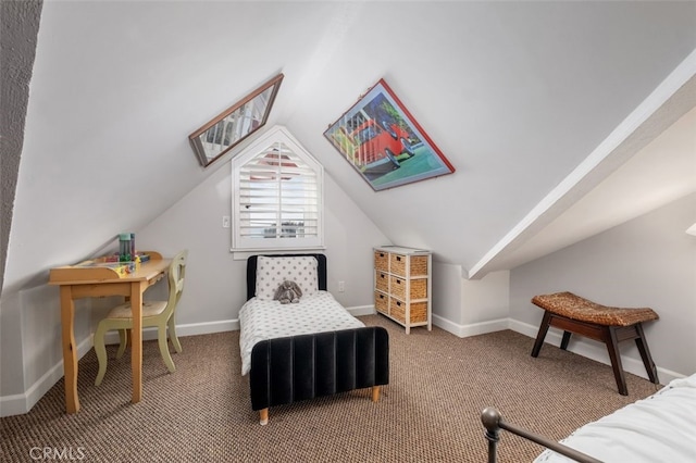 bedroom with lofted ceiling, carpet flooring, and baseboards