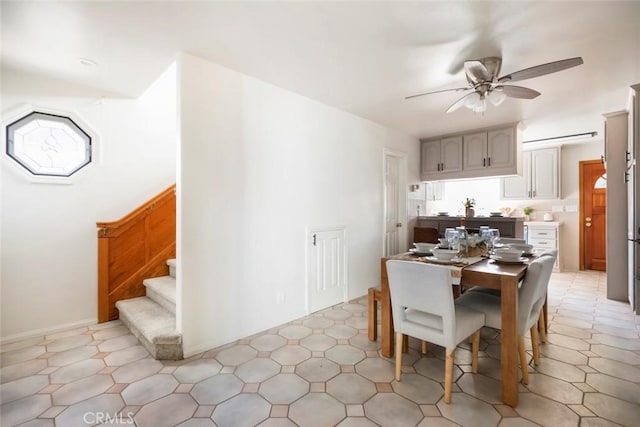 dining space with ceiling fan