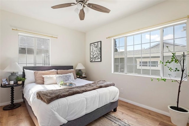 bedroom featuring hardwood / wood-style flooring and ceiling fan