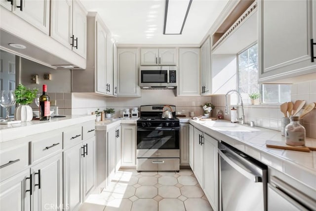 kitchen with white cabinetry, appliances with stainless steel finishes, and sink