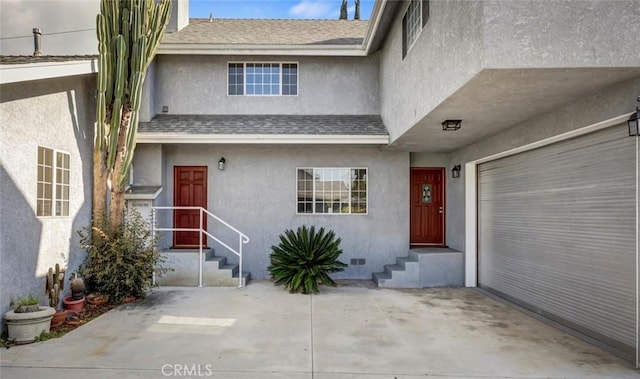 property entrance with a garage