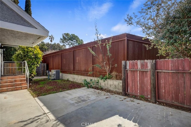 exterior space featuring central AC unit and a patio area