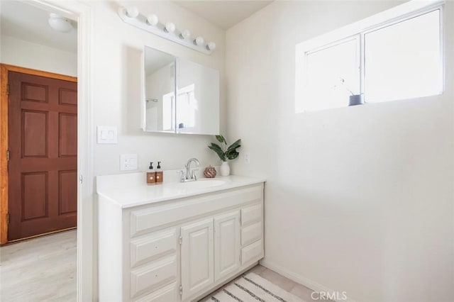 bathroom with vanity and plenty of natural light