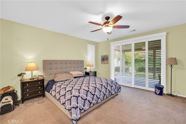 bedroom featuring ceiling fan, access to exterior, and light carpet