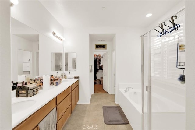 bathroom with plus walk in shower and vanity