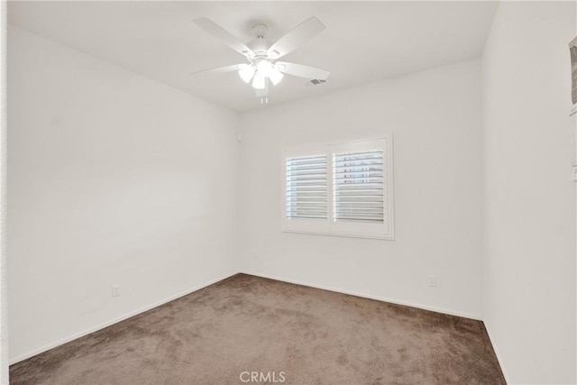 spare room with carpet flooring and ceiling fan