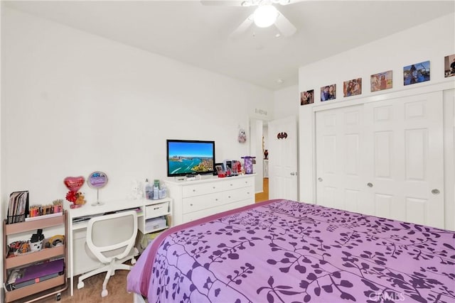 bedroom featuring ceiling fan and a closet