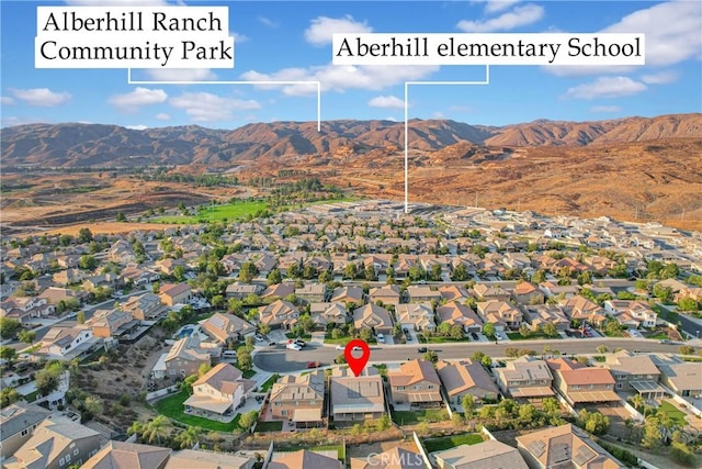 birds eye view of property featuring a mountain view