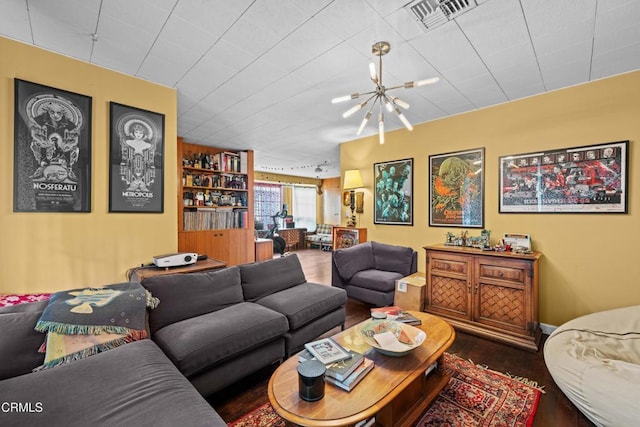 living room featuring hardwood / wood-style floors and a notable chandelier