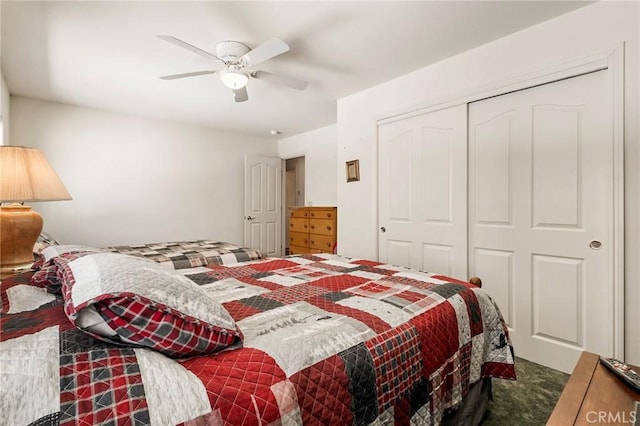 carpeted bedroom with a closet and ceiling fan