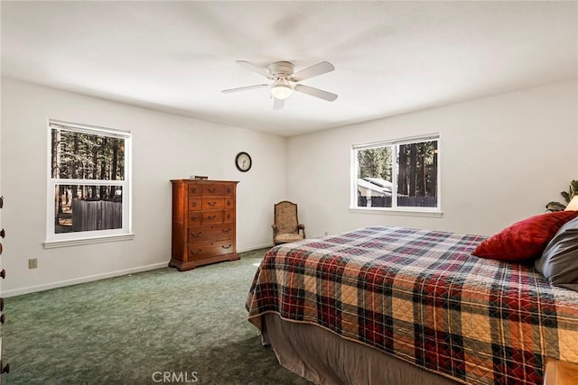 carpeted bedroom with a ceiling fan and baseboards