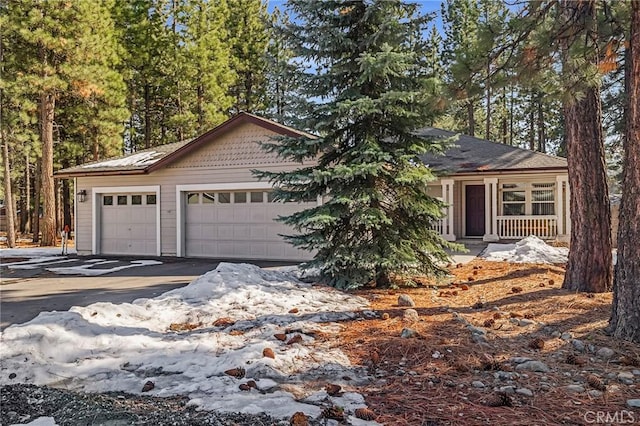 single story home featuring an attached garage and driveway