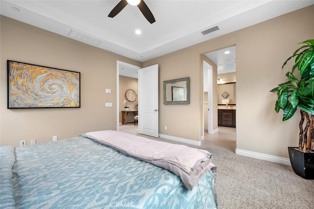 carpeted bedroom with ceiling fan, recessed lighting, visible vents, baseboards, and ensuite bath