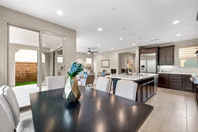 dining room with a ceiling fan, light tile patterned flooring, a wealth of natural light, and recessed lighting