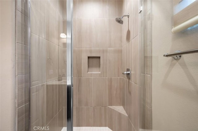 bathroom featuring a shower stall