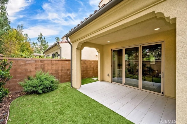 view of yard featuring a patio area and fence