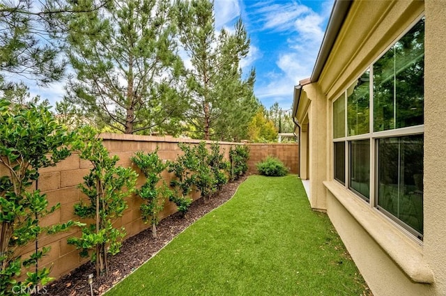 view of yard with a fenced backyard