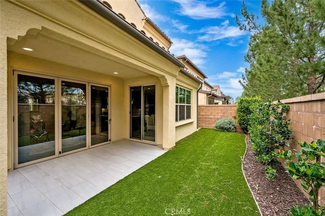 exterior space featuring a patio area and a fenced backyard