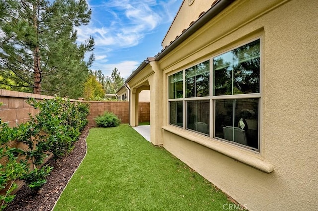 view of yard with a fenced backyard