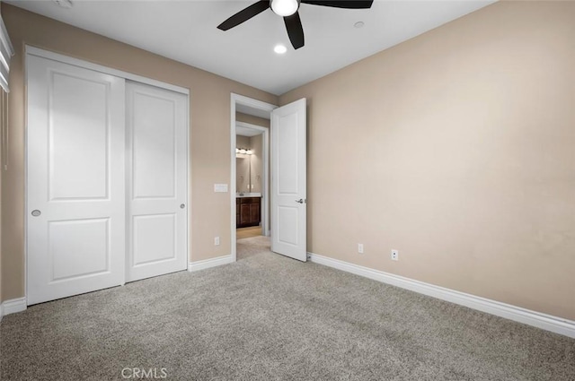 unfurnished bedroom with recessed lighting, a closet, light colored carpet, ceiling fan, and baseboards