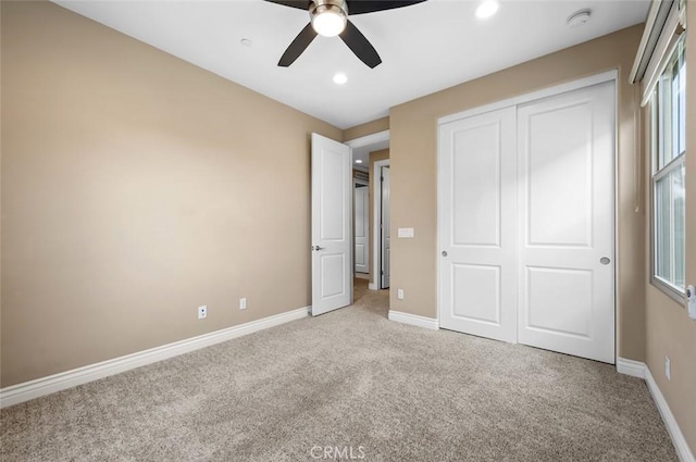 unfurnished bedroom with carpet floors, recessed lighting, a closet, ceiling fan, and baseboards