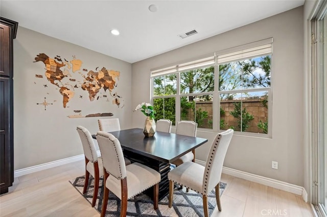 dining room with baseboards, visible vents, and recessed lighting