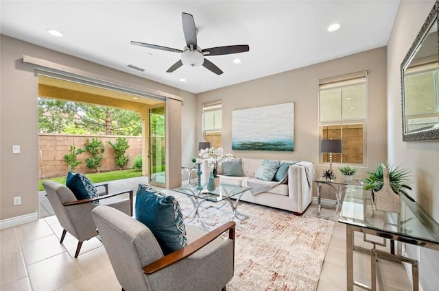 living area with baseboards, light tile patterned flooring, visible vents, and recessed lighting