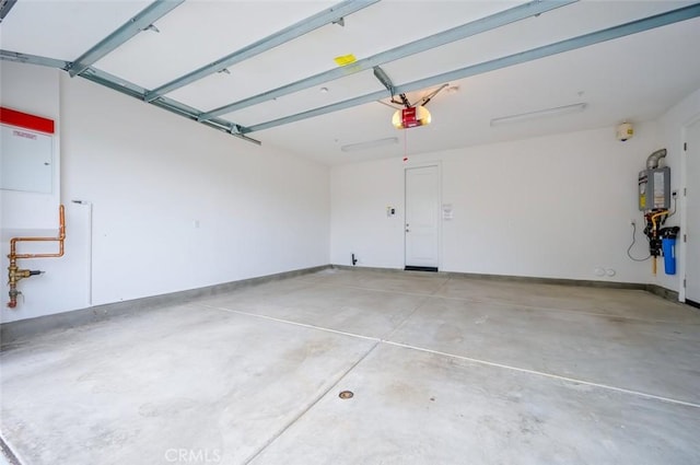 garage featuring water heater, baseboards, and a garage door opener