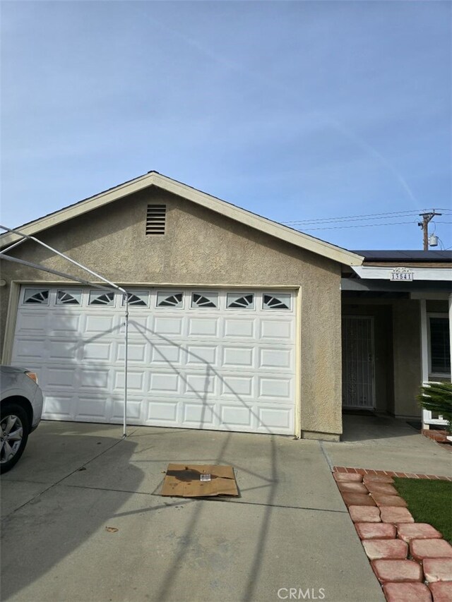 view of side of property featuring a garage