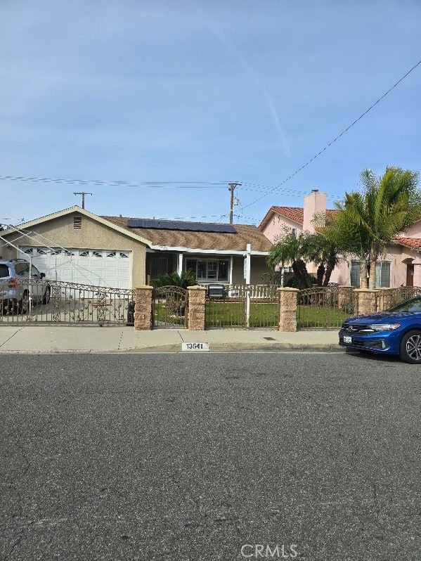 ranch-style house featuring a garage