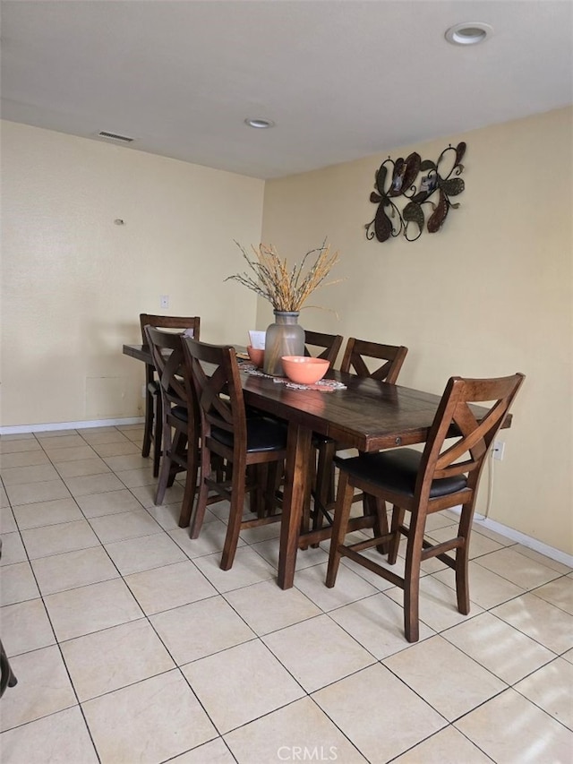 dining area featuring light tile patterned floors