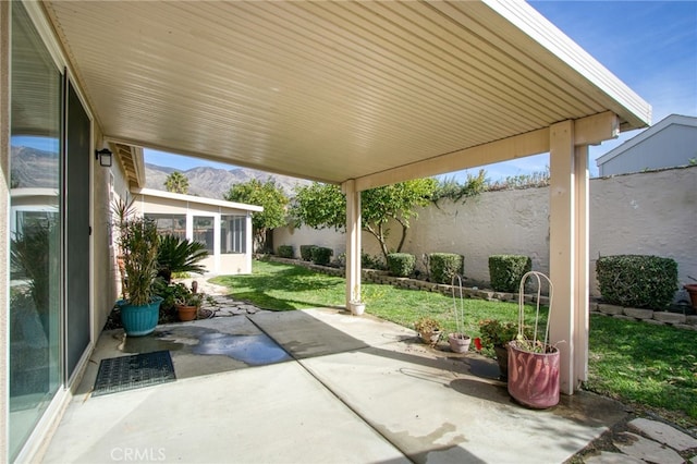 view of patio with a sunroom