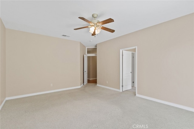 unfurnished bedroom with ceiling fan and light carpet