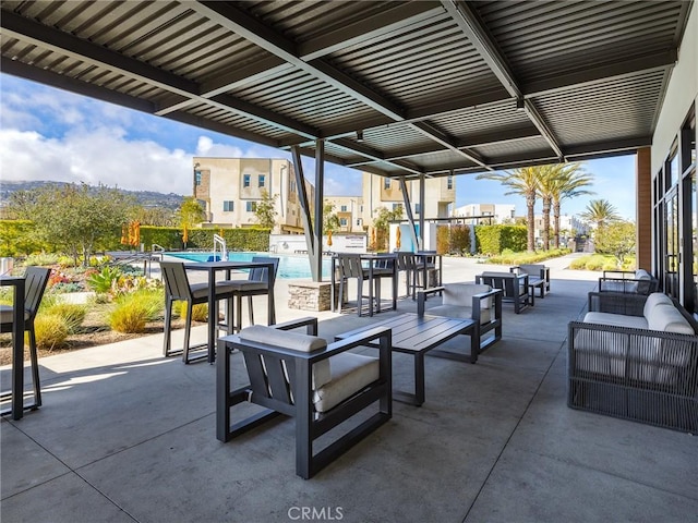 view of patio with an outdoor pool and an outdoor hangout area