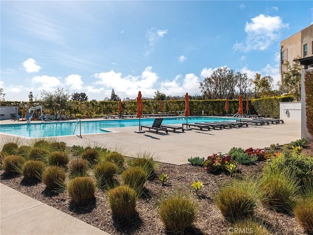 community pool featuring a patio