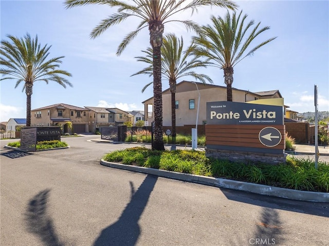community / neighborhood sign featuring a residential view