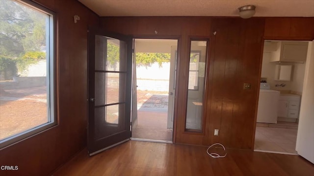 entryway featuring hardwood / wood-style flooring and washer / clothes dryer