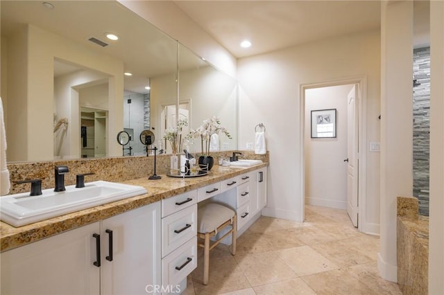 bathroom with vanity and tile patterned flooring