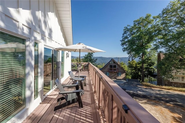 wooden terrace with a mountain view