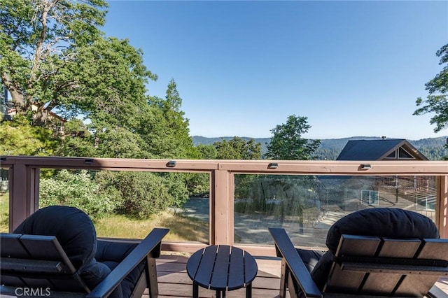 balcony featuring a mountain view