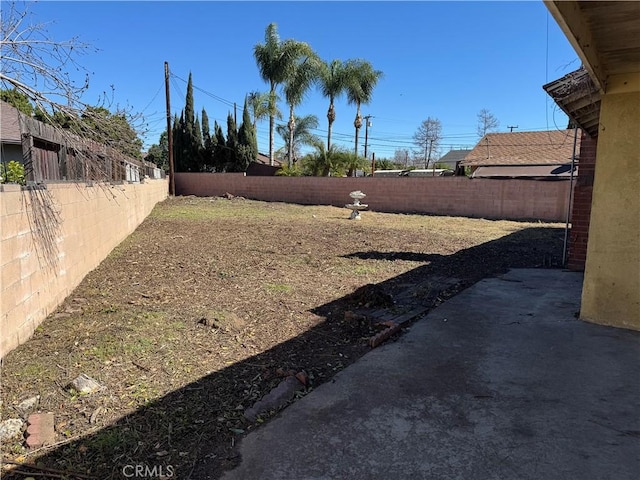 view of yard with a fenced backyard