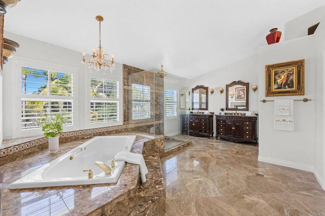 bathroom featuring vanity, plus walk in shower, and an inviting chandelier